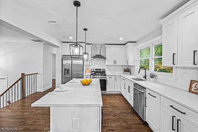 192 Mohawk Trl, Wayne Twp, NJ 07470 - kitchen with stainless steel appliances, a sink, wall chimney exhaust hood, a center island, and dark wood-style floors
