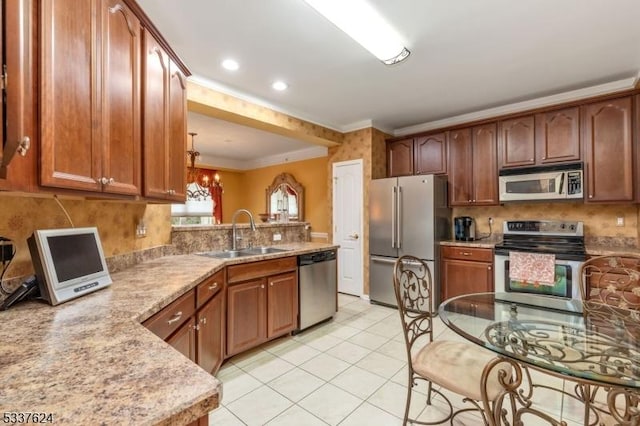 2307 Ambassador Ct Unit 2307, Franklin Twp, NJ 08873 - kitchen featuring stainless steel appliances, a sink, crown molding, tasteful backsplash, and a peninsula