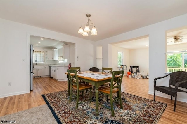 715 Pittstown Rd, Franklin Twp, NJ 08825 - dining area with light wood-type flooring, healthy amount of natural light, and a chandelier