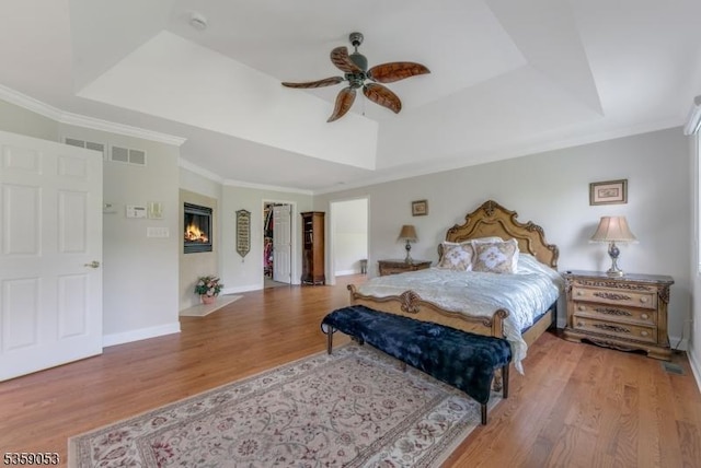 4 Greenbriar Ct, Mount Olive Twp, NJ 07836 - bedroom with a raised ceiling, wood finished floors, crown molding, a ceiling fan, and baseboards