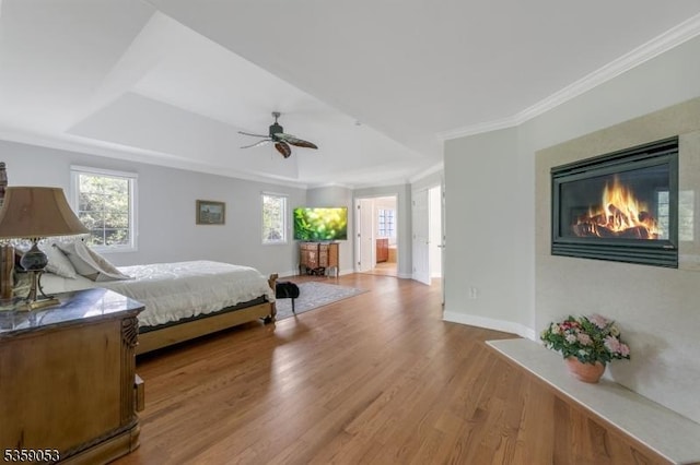 4 Greenbriar Ct, Mount Olive Twp, NJ 07836 - bedroom with wood finished floors, baseboards, a raised ceiling, multiple windows, and crown molding