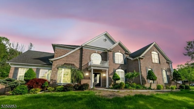 4 Greenbriar Ct, Mount Olive Twp, NJ 07836 - colonial-style house with brick siding, a balcony, and a front yard