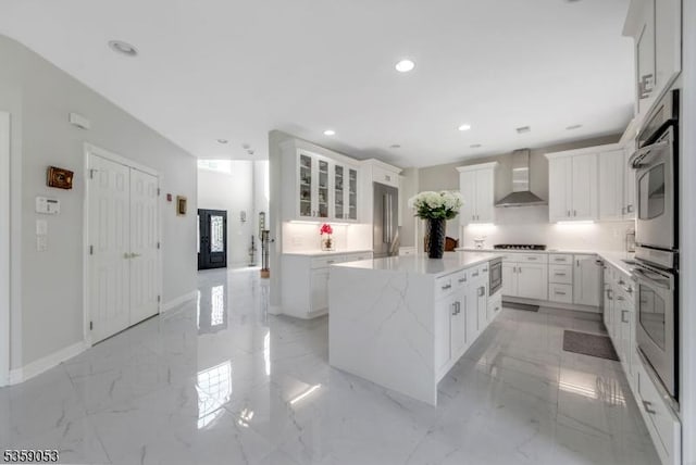 4 Greenbriar Ct, Mount Olive Twp, NJ 07836 - kitchen with wall chimney range hood, a kitchen island, recessed lighting, white cabinets, and appliances with stainless steel finishes