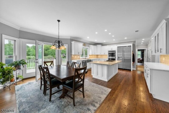 1 Fleming Rd, Tewksbury Twp, NJ 07830 - dining area featuring dark wood finished floors, plenty of natural light, a chandelier, recessed lighting, and ornamental molding