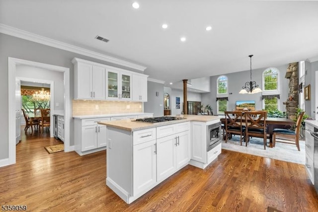 1 Fleming Rd, Tewksbury Twp, NJ 07830 - kitchen featuring a chandelier, stainless steel appliances, light countertops, wood finished floors, and recessed lighting