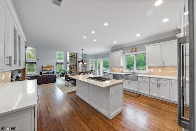 1 Fleming Rd, Tewksbury Twp, NJ 07830 - kitchen with a sink, ornamental molding, white cabinetry, wood finished floors, and stainless steel appliances