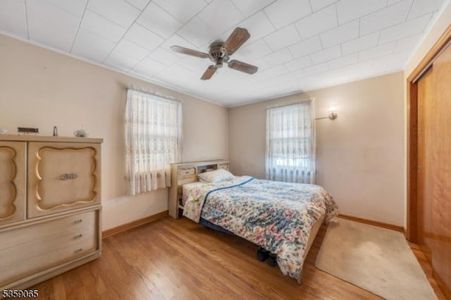 36 Bogert St, Totowa Boro, NJ 07512 - bedroom with multiple windows, baseboards, wood finished floors, and ceiling fan