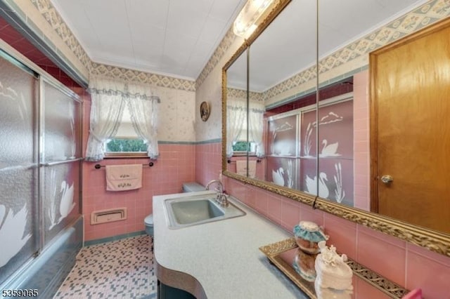 36 Bogert St, Totowa Boro, NJ 07512 - full bath with wallpapered walls, wainscoting, toilet, vanity, and tile walls