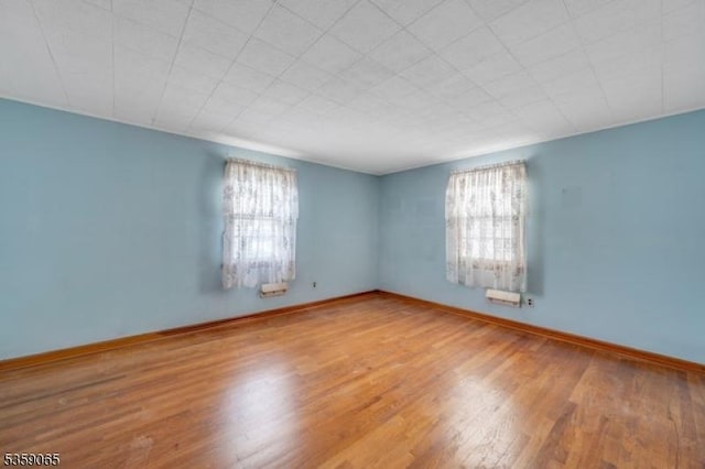36 Bogert St, Totowa Boro, NJ 07512 - spare room featuring plenty of natural light, wood finished floors, and baseboards