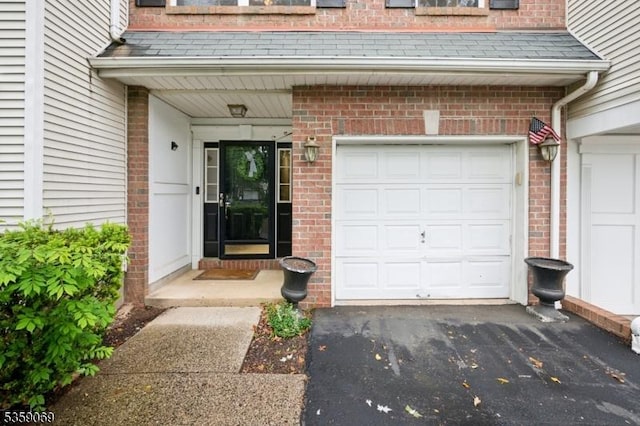 5 Prescott Ct, Condo, Bernards Twp, NJ 07920 - doorway to property with brick siding, a garage, and driveway