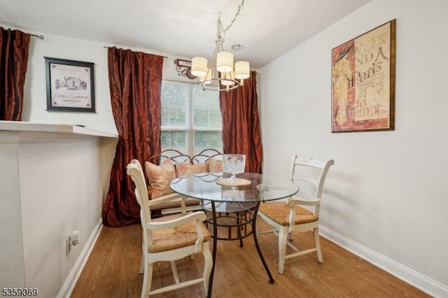5 Prescott Ct, Condo, Bernards Twp, NJ 07920 - dining space featuring baseboards, wood finished floors, and a chandelier
