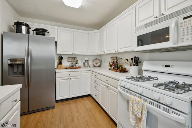 5 Prescott Ct, Condo, Bernards Twp, NJ 07920 - kitchen featuring white appliances, light countertops, white cabinetry, and light wood-style floors