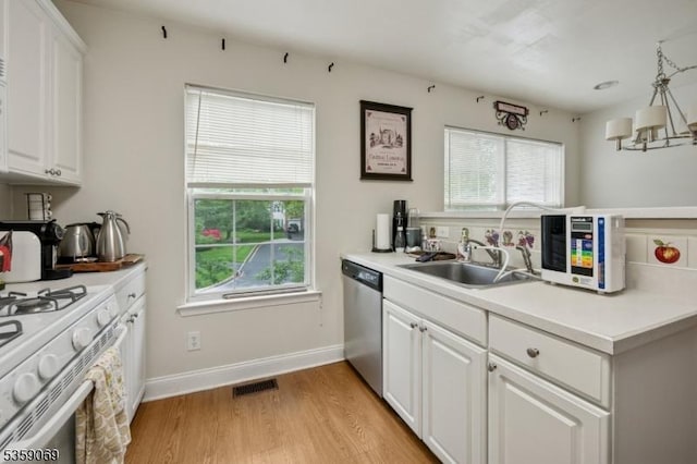 5 Prescott Ct, Condo, Bernards Twp, NJ 07920 - kitchen with dishwasher, white gas range, healthy amount of natural light, and light wood finished floors