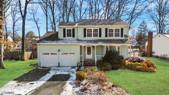 231 Sutphin Ln, Hillsborough Twp, NJ 08844 - traditional-style home featuring asphalt driveway, a porch, and an attached garage
