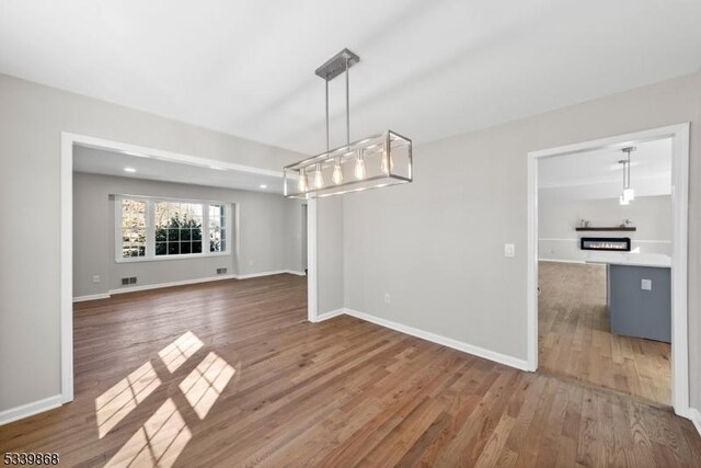 231 Sutphin Ln, Hillsborough Twp, NJ 08844 - unfurnished dining area with wood finished floors and baseboards