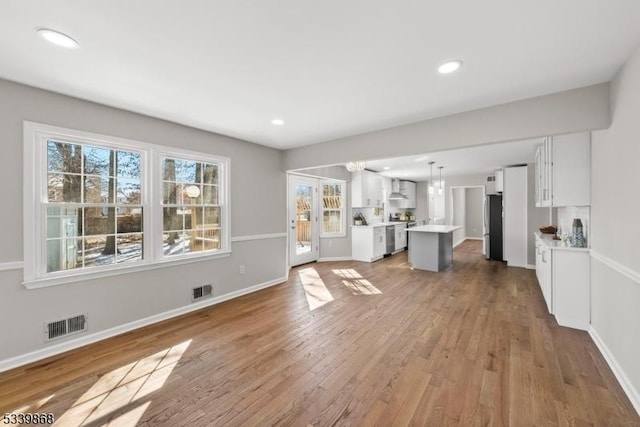 231 Sutphin Ln, Hillsborough Twp, NJ 08844 - unfurnished living room featuring wood finished floors, baseboards, and recessed lighting