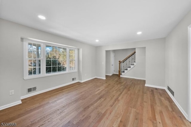 231 Sutphin Ln, Hillsborough Twp, NJ 08844 - unfurnished living room with stairway, wood finished floors, baseboards, and recessed lighting