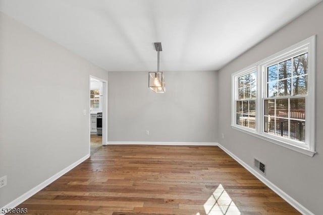 231 Sutphin Ln, Hillsborough Twp, NJ 08844 - unfurnished dining area with baseboards and light wood-style flooring