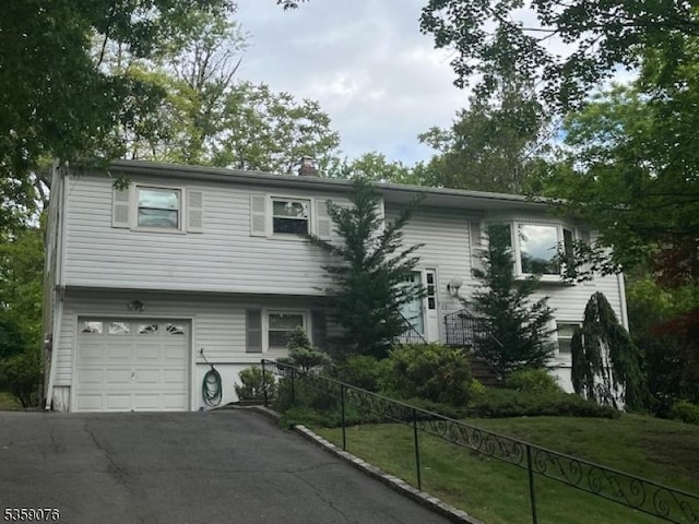 53 Edgemere Rd, Livingston Twp, NJ 07039 - view of front of house with driveway, an attached garage, and a chimney