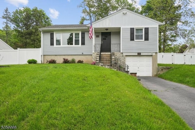 20 New Jersey Ave, Jefferson Twp, NJ 07849 - view of front of house with an attached garage, asphalt driveway, and a gate