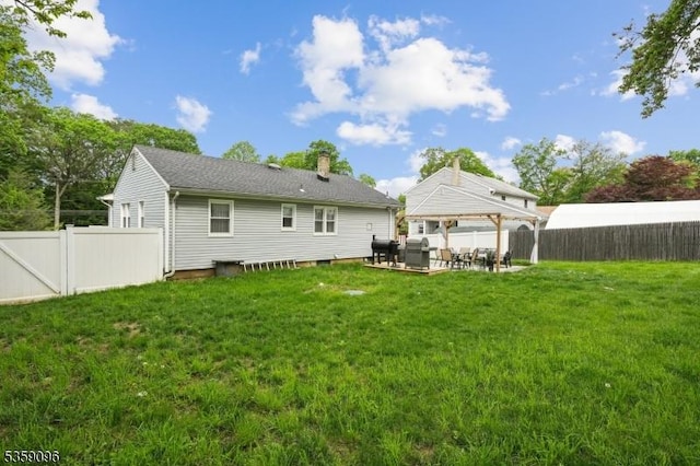 20 New Jersey Ave, Jefferson Twp, NJ 07849 - back of property with a gazebo, a patio, an outdoor hangout area, and a chimney