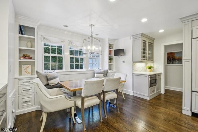 42 Haddonfield Rd, Millburn Twp, NJ 07078 - dining area with dark wood-style flooring, recessed lighting, a chandelier, and baseboards
