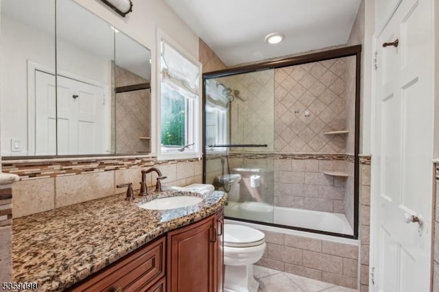 42 Haddonfield Rd, Millburn Twp, NJ 07078 - full bathroom featuring vanity, tiled shower / bath, toilet, tile patterned flooring, and decorative backsplash