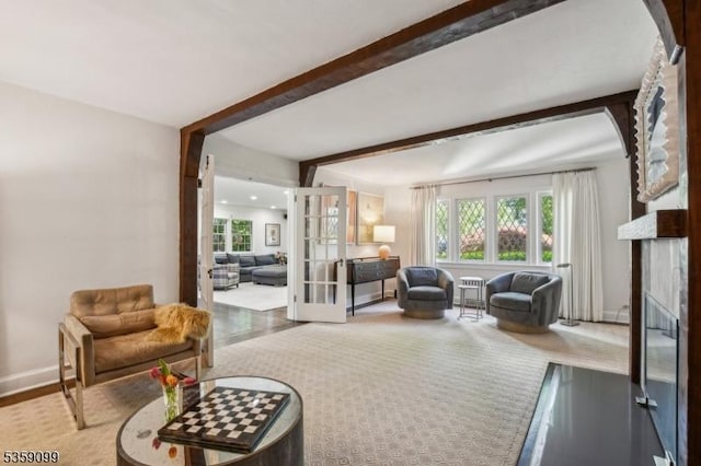 42 Haddonfield Rd, Millburn Twp, NJ 07078 - living area with wood finished floors, french doors, a fireplace, and beam ceiling