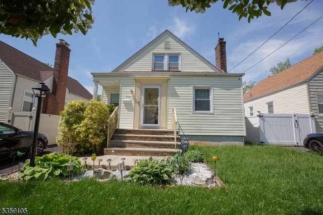 916 Sheridan Ave, Roselle Boro, NJ 07203 - view of front of home with entry steps, a gate, and a chimney
