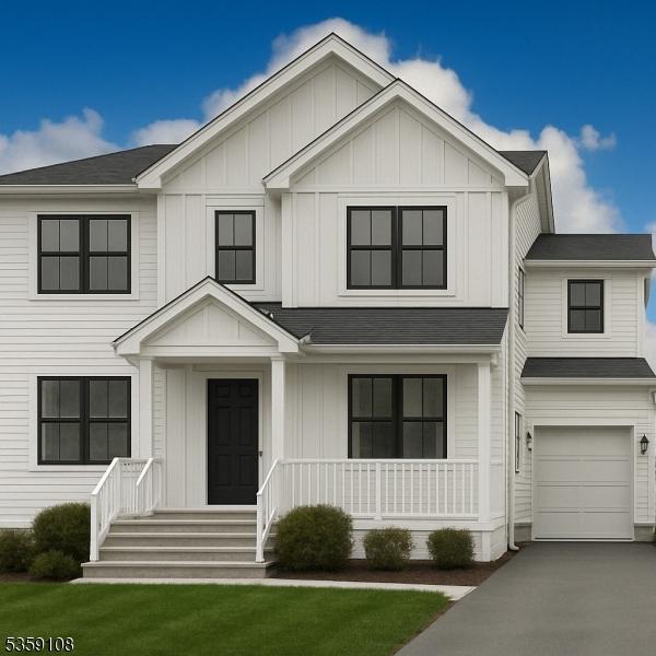 5 Iroquois Rd, Cranford Twp, NJ 07016 - modern inspired farmhouse featuring covered porch, board and batten siding, a garage, asphalt driveway, and a front lawn