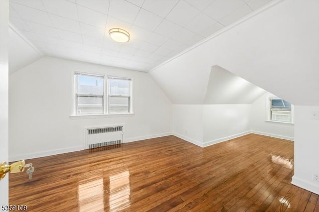 344 Elmwood Ave, East Orange City, NJ 07018 - additional living space with radiator, wood-type flooring, lofted ceiling, and baseboards