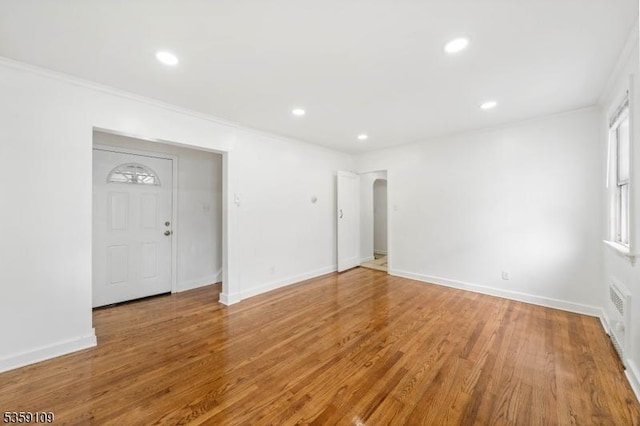 344 Elmwood Ave, East Orange City, NJ 07018 - unfurnished room featuring recessed lighting, wood finished floors, baseboards, arched walkways, and crown molding