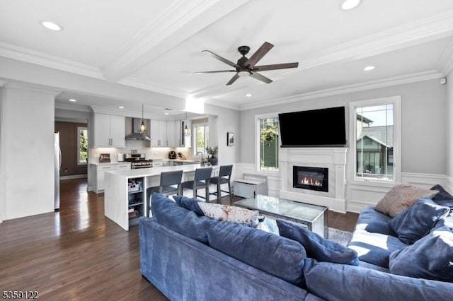 12-64 Orchard St, Fair Lawn Boro, NJ 07410 - living room with dark wood-style floors, a glass covered fireplace, a ceiling fan, ornamental molding, and recessed lighting