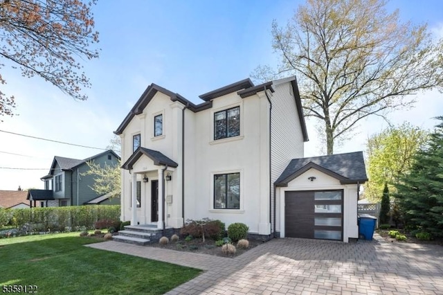 12-64 Orchard St, Fair Lawn Boro, NJ 07410 - view of front of house with decorative driveway, a front yard, and stucco siding