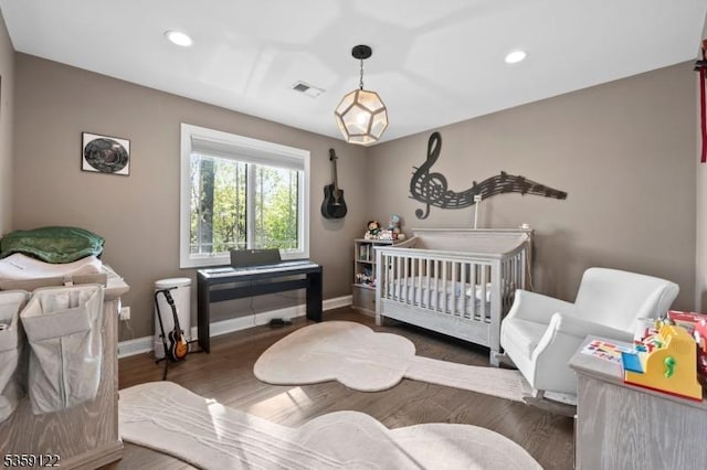 12-64 Orchard St, Fair Lawn Boro, NJ 07410 - bedroom with baseboards, wood finished floors, recessed lighting, and a nursery area