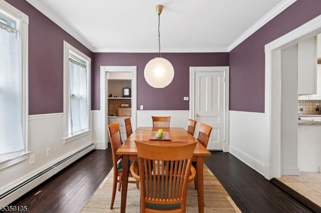 457 Academy St, South Orange Village Twp, NJ 07079 - dining space with baseboard heating, dark wood-type flooring, ornamental molding, and wainscoting