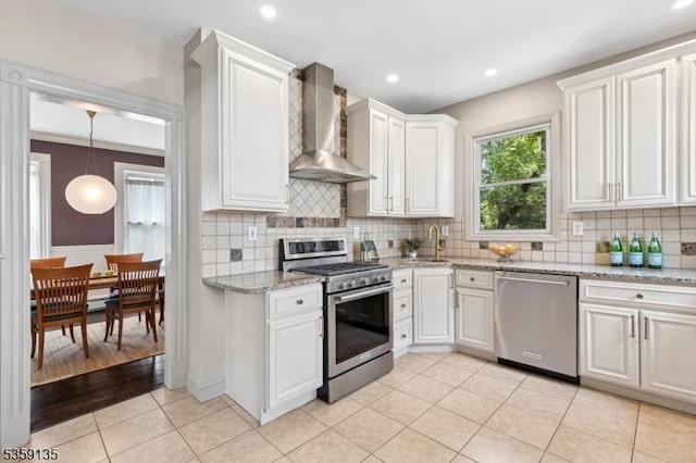 457 Academy St, South Orange Village Twp, NJ 07079 - kitchen with stainless steel appliances, wall chimney exhaust hood, decorative backsplash, white cabinetry, and recessed lighting