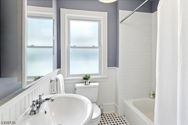 457 Academy St, South Orange Village Twp, NJ 07079 - full bath featuring toilet, shower / tub combo with curtain, a wainscoted wall, a sink, and tile patterned flooring