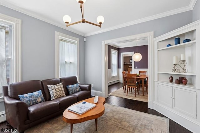 457 Academy St, South Orange Village Twp, NJ 07079 - living room featuring a baseboard heating unit, dark wood finished floors, crown molding, a chandelier, and baseboards