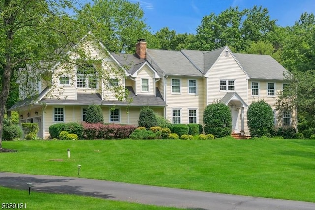 60 Dogwood Ln, Montgomery Twp, NJ 08558 - view of front of house featuring a chimney and a front yard