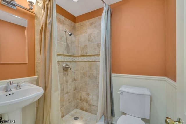 60 Dogwood Ln, Montgomery Twp, NJ 08558 - bathroom with a stall shower, wainscoting, a sink, and toilet