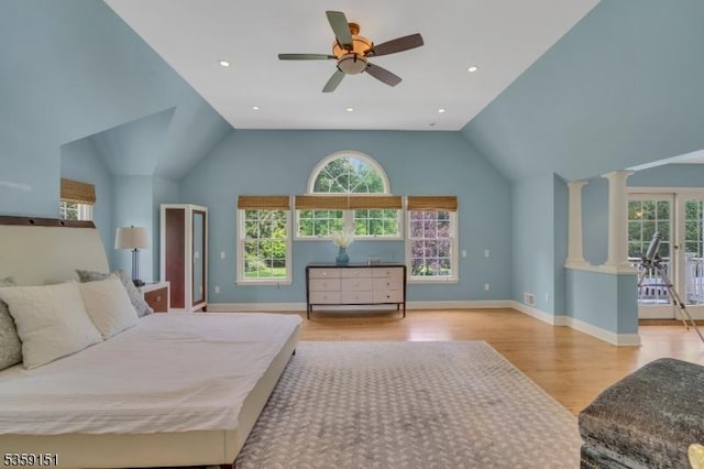 60 Dogwood Ln, Montgomery Twp, NJ 08558 - bedroom with multiple windows, wood finished floors, lofted ceiling, ornate columns, and baseboards