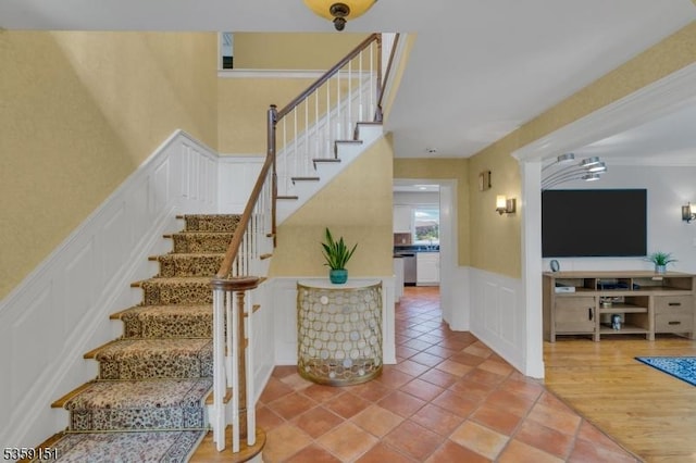 60 Dogwood Ln, Montgomery Twp, NJ 08558 - stairs with a decorative wall, wainscoting, and tile patterned flooring