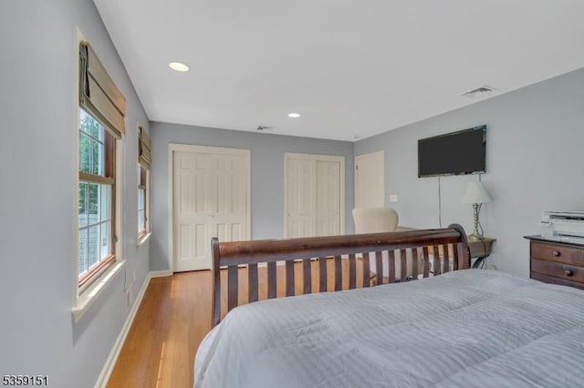 60 Dogwood Ln, Montgomery Twp, NJ 08558 - bedroom with multiple closets, wood finished floors, baseboards, and recessed lighting