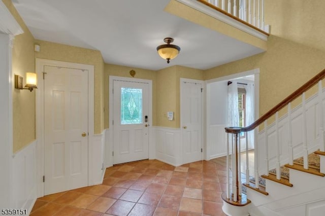 60 Dogwood Ln, Montgomery Twp, NJ 08558 - entryway with a decorative wall, a wainscoted wall, stairway, and light tile patterned floors