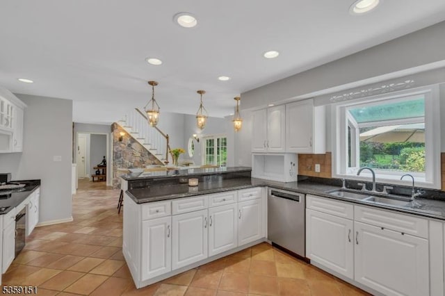 60 Dogwood Ln, Montgomery Twp, NJ 08558 - kitchen with stainless steel dishwasher, a peninsula, healthy amount of natural light, white cabinetry, and recessed lighting