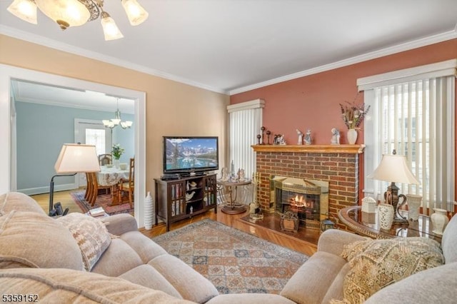 756-758 Cleveland Ave, Elizabeth City, NJ 07208 - living room with wood finished floors, a chandelier, a brick fireplace, crown molding, and baseboards
