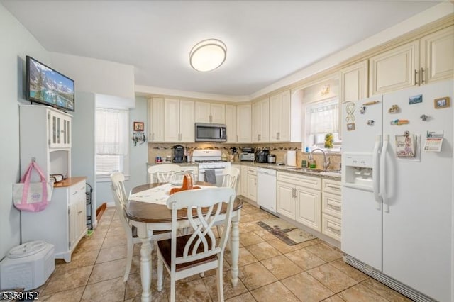 756-758 Cleveland Ave, Elizabeth City, NJ 07208 - kitchen with white appliances, cream cabinetry, tasteful backsplash, light countertops, and a sink