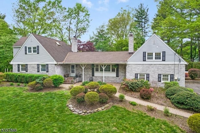 209 Lake Rd, Bernards Twp, NJ 07920 - view of front facade with a chimney, a front lawn, and brick siding