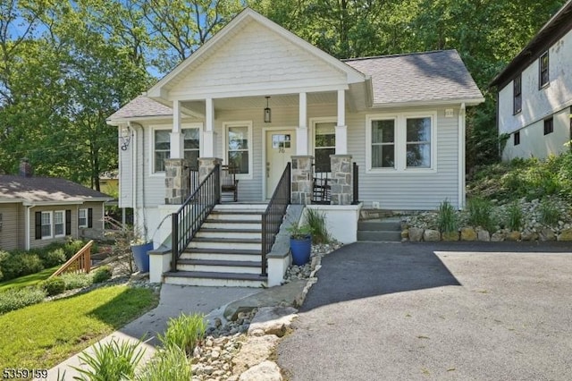 76 Mountainview Ave, Mount Arlington Boro, NJ 07856 - view of front facade with a shingled roof and covered porch